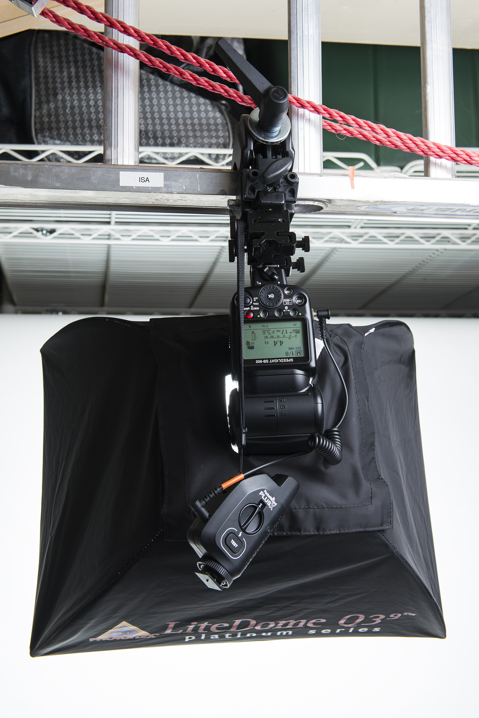 Figure 3.  Flash in a Photoflex softbox being held to a ladder via a Manfrotto C-Clamp.